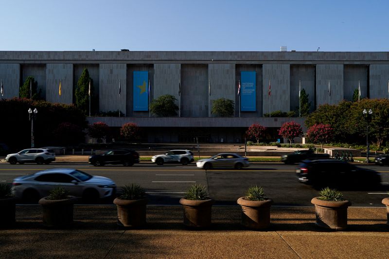 FILE PHOTO: Cars drive by the Smithsonian’s National Museum of American History in Washington, D.C., U.S., August 15, 2025. REUTERS/Elizabeth Frantz/File Photo