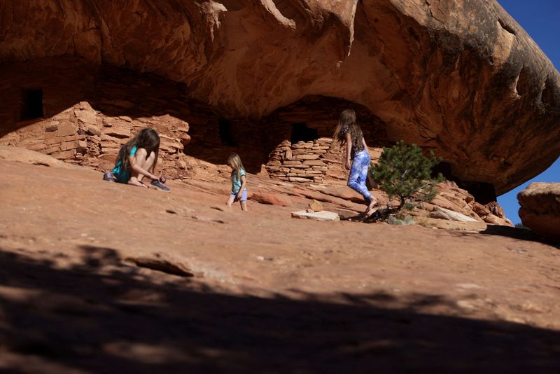 FILE PHOTO: Children explore as the sun sets on the ancestral Puebloan House on Fire ruins in the Bears Ears National Monument outside Blanding, Utah, U.S., October 22, 2023. REUTERS/Jim Urquhart/File Photo