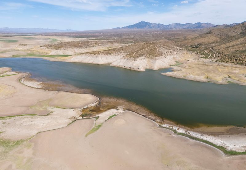 A drone view shows low water levels at San Carlos Reservoir near Peridot, Arizona, U.S. July 3, 2026. REUTERS/Rebecca Noble