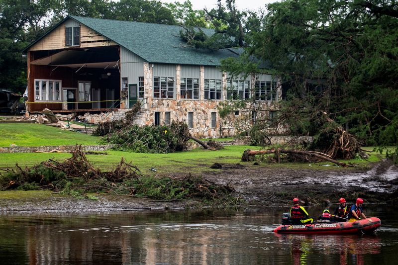 FILE PHOTO: Search teams continue searching for flood victims near Camp Mystic, in the aftermath of deadly flooding in Kerr County, Texas, U.S., July 7, 2025. REUTERS/Sergio Flores/File Photo