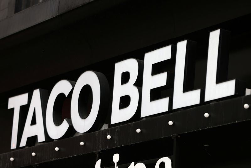 The logo of Taco Bell, a subsidiary of Yum! Brands, Inc. is seen in Manhattan, New York City, U.S., February 7, 2022. REUTERS/Andrew Kelly/File Photo