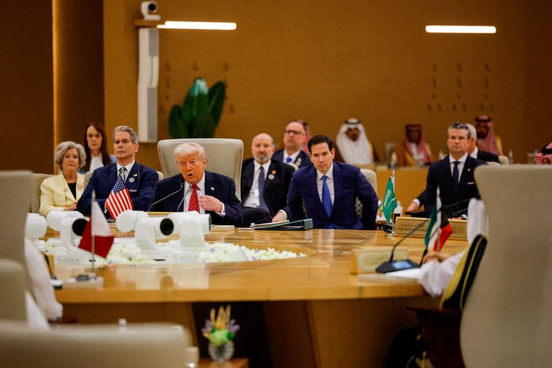 FILE PHOTO: U.S. President Donald Trump speaks at the Gulf Cooperation Council (GCC), in front of U.S. Secretary of State Marco Rubio and Defense Secretary Pete Hegseth, in Riyadh, Saudi Arabia, May 14, 2025. REUTERS/Brian Snyder/File Photo
