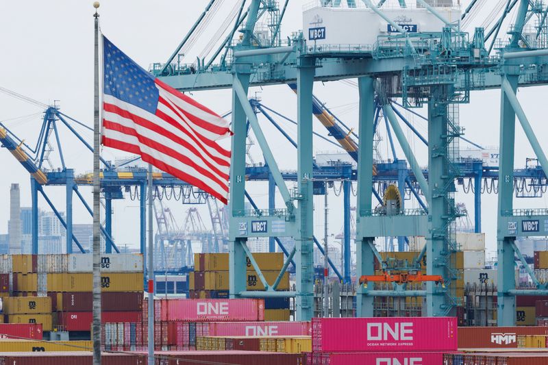 FILE PHOTO: Shipping containers from China sit at the Port of Los Angeles in San Pedro, California, U.S., November 5, 2025. REUTERS/Mike Blake/File Photo