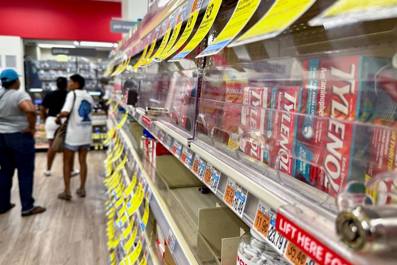 Tylenol is displayed for sale behind a locked anti-theft barrier at a pharmacy in Washington, D.C., U.S., September 5, 2025. REUTERS/Jonathan Ernst/File Photo