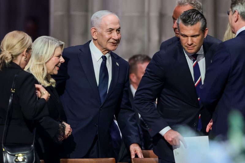 FILE PHOTO: Israeli Prime Minister Benjamin Netanyahu with his wife Sara, U.S. Defense Secretary Pete Hegseth and other officials on the day of the funeral service for late U.S. Senator Lindsey Graham (R-SC) at Washington National Cathedral in Washington, D.C., U.S., July 28, 2026. REUTERS/Evelyn Hockstein/File Photo