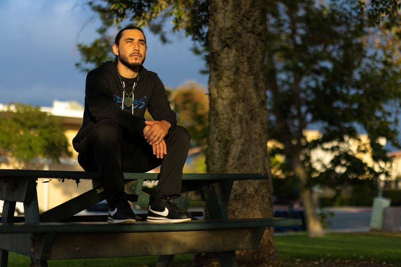 Christian Garcia, who was charged by the U.S. government following an immigration protest only to have all charges dropped, poses for a portrait at a park in Costa Mesa, California, U.S., June 17, 2026. REUTERS/Mike Blake