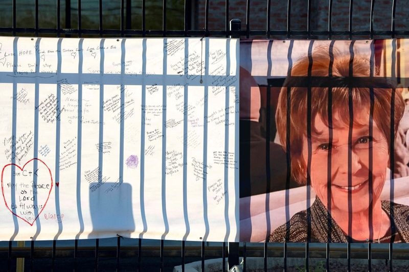 FILE PHOTO: A banner with a growing collection of well-wishes from supporters reads "bring her home" (not pictured) and shows a photo of Nancy Guthrie, the 84-year-old mother of U.S. journalist and television host Savannah Guthrie, who disappeared from her home nearly two weeks ago, outside of the KVOA newsroom in Tucson, Arizona, U.S., February 14, 2026. REUTERS/Rebecca Noble/File Photo