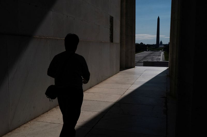 A visitor to the Lincoln Memorial walks near the drained Reflecting Pool, following renovations and Independence Day celebrations, in Washington, D.C., U.S., July 30, 2026. REUTERS/Nathan Howard