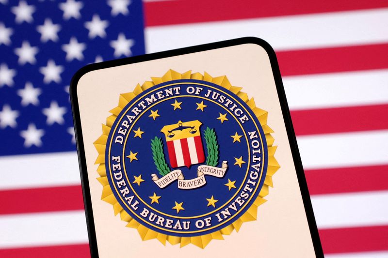 FILE PHOTO: United States Department of Justice logo and U.S. flag are seen in this illustration created on April 23, 2025. REUTERS/Dado Ruvic/Illustration/File Photo