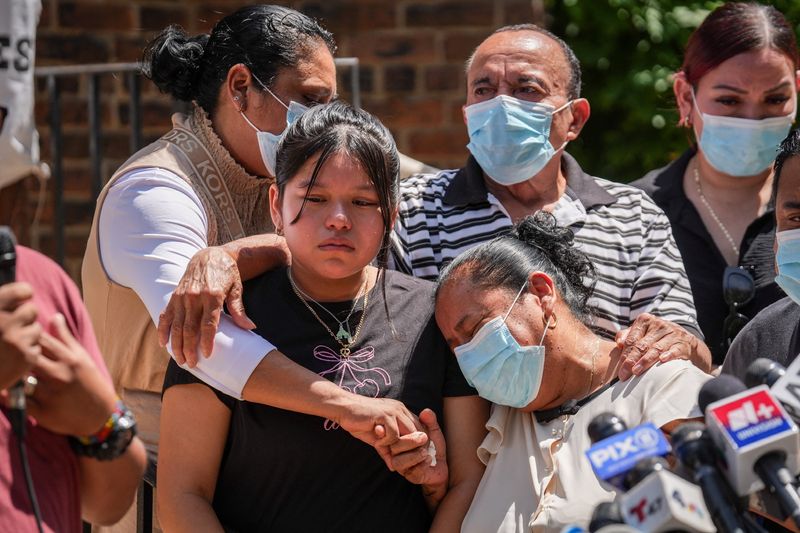 The daughter of Edwin Lopez-Cornejo, who died on Saturday while in ICE custody, is consoled by family members during a press conference in Highland Park, New Jersey, U.S., August 4, 2026.   REUTERS/Ryan Murphy