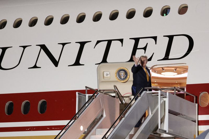 FILE PHOTO: U.S. President Donald Trump boards the new, Qatari-gifted Air Force One after arriving on one of the older planes operating as Air Force One, to return to Washington after his participation in a NATO leaders summit in Turkey, at RAF Mildenhall, in Suffolk, Britain, July 8, 2026. REUTERS/Jonathan Ernst/File Photo