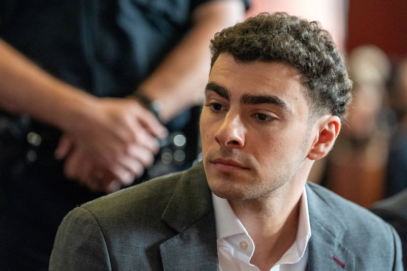 FILE PHOTO: Luigi Mangione attends a pre-trial appearance at Manhattan Criminal Court, in New York City, U.S., August 11, 2026. REUTERS/David Dee Delgado/Pool/File Photo