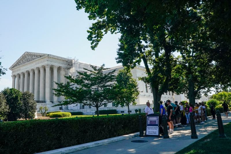 People wait in line outside the U.S. Supreme Court the morning before justices are expected to issue opinions in pending cases, in Washington, U.S., June 14, 2024.
