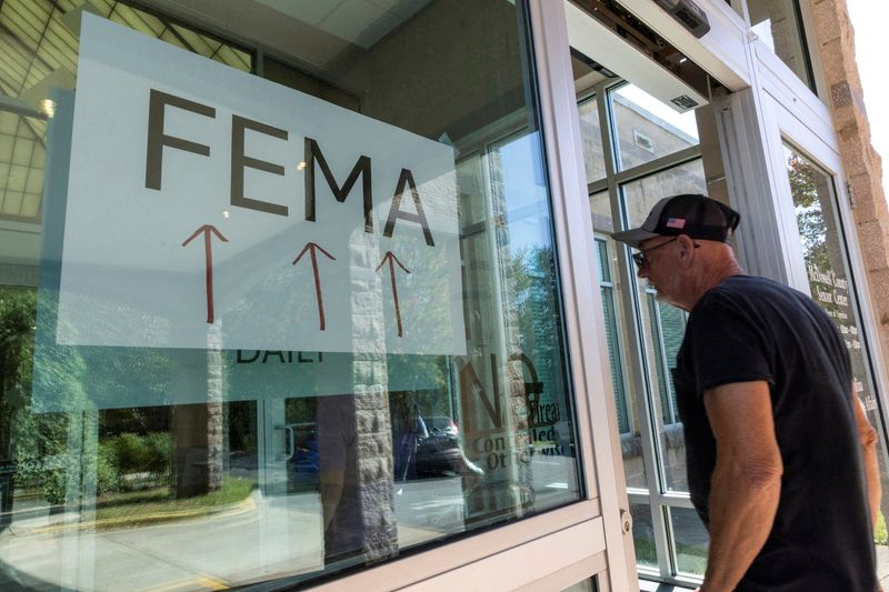 FILE PHOTO: A resident enters a FEMA improvised station to attend claims by local residents affected by floods following the passing of Hurricane Helene, in Marion, North Carolina, U.S., October 5, 2024. REUTERS/Eduardo Munoz/File Photo