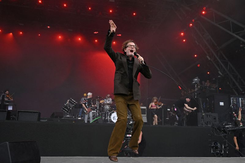FILE PHOTO: Jarvis Cocker of Pulp performs on the pyramid stage at Glastonbury Festival at Worthy Farm in Pilton, Somerset, Britain, June 28, 2025. REUTERS/Jaimi Joy/File Photo