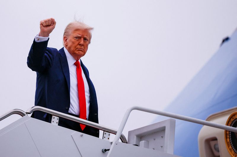 FILE PHOTO: U.S. President Donald Trump gestures, as he boards Air Force One at Joint Base Andrews, Maryland, U.S., September 21, 2025.  REUTERS/Brian Snyder/File Photo