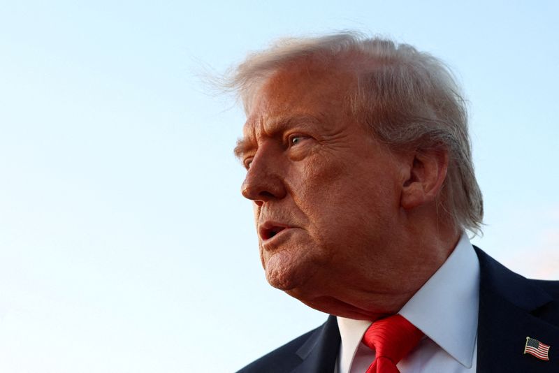 FILE PHOTO: U.S. President Donald Trump looks on as he speaks to the press at Joint Base Andrews in Maryland, U.S., September 7, 2025. REUTERS/Evelyn Hockstein/ File Photo