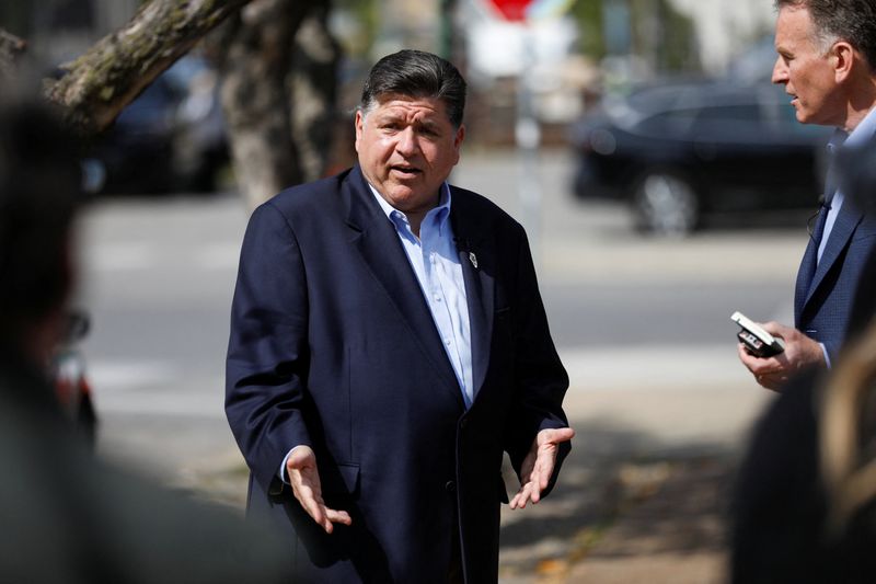 Illinois Gov. JB Pritzker talks with NPR Morning Edition host Steve Inskeep during a visit to the Chicago neighborhood of Pilsen, days after U.S. President Donald Trump ordered an increased federal law enforcement presence in the city along with stepped-up immigration enforcement actions carried out by the Department of Homeland Security, in Chicago, Illinois, U.S. September 9, 2025. REUTERS/Octavio Jones