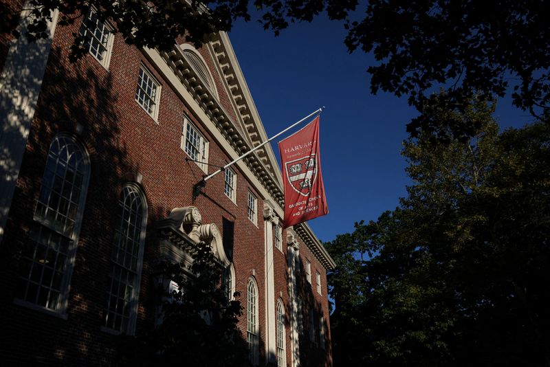 FILE PHOTO: A flag hangs on campus at Harvard University in Cambridge, Massachusetts, U.S., September 4, 2025. REUTERS/Shannon Stapleton/File Photo
