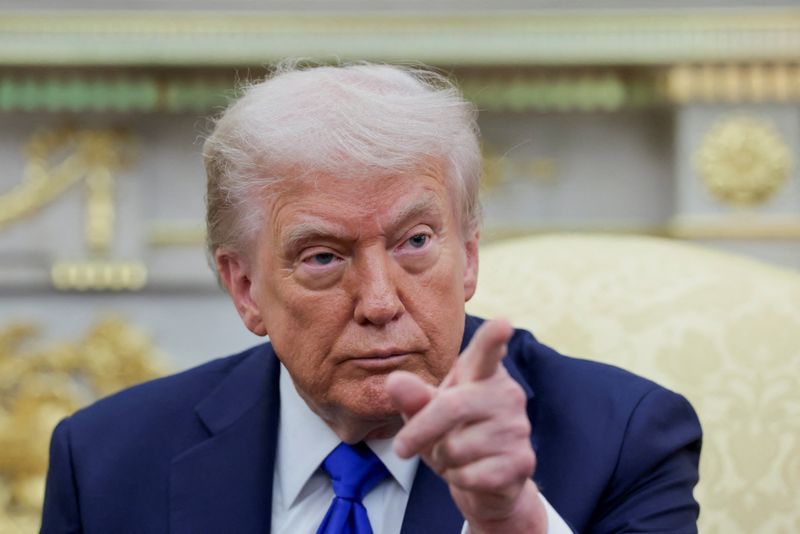 U.S. President Donald Trump gestures as he and Canada's Prime Minister Mark Carney (not pictured) meet in the Oval Office at the White House in Washington, D.C., U.S., October 7, 2025. REUTERS/Evelyn Hockstein