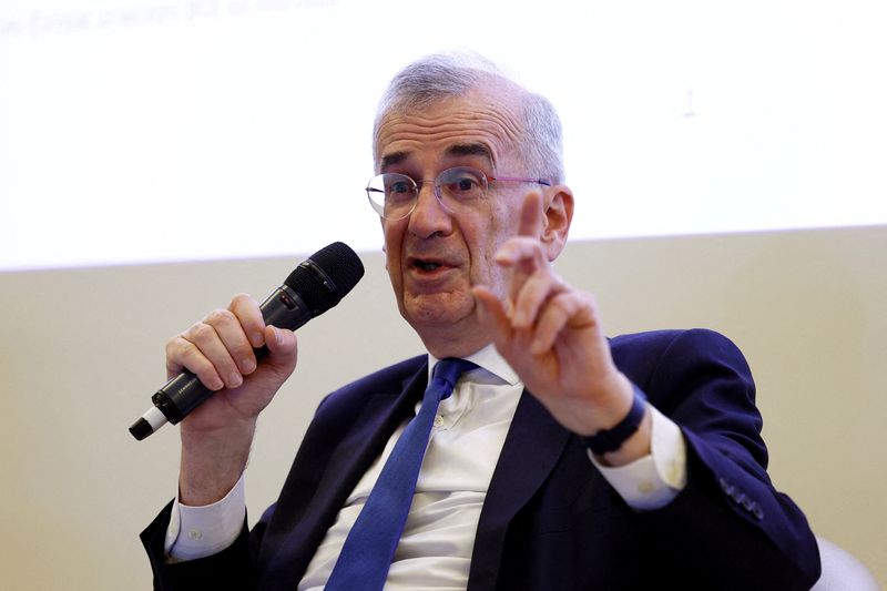 FILE PHOTO: Francois Villeroy de Galhau, Governor of Banque de France, gestures as he talks with journalists after a press conference in Paris, France, April 9, 2025.  REUTERS/Abdul Saboor/File Photo