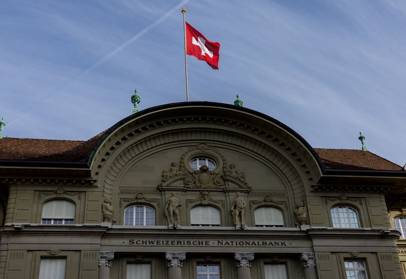 FILE PHOTO: A flag is pictured on the Swiss National Bank (SNB) building in Bern, Switzerland, November 6, 2024. REUTERS/Denis Balibouse/File Photo