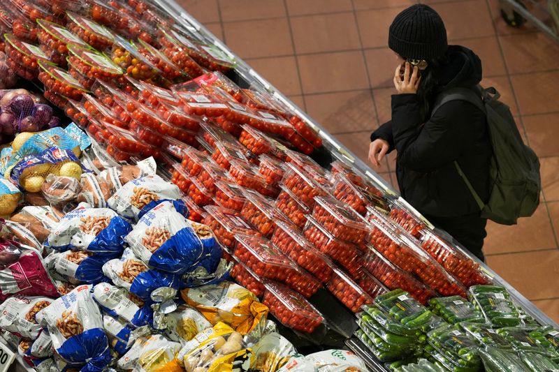 FILE PHOTO: A person browses a grocery store following the announcement of tariffs on Canadian and Mexican goods by U.S. President Donald Trump, in Toronto, Ontario, Canada March 4, 2025. REUTERS/Arlyn McAdorey/File Photo