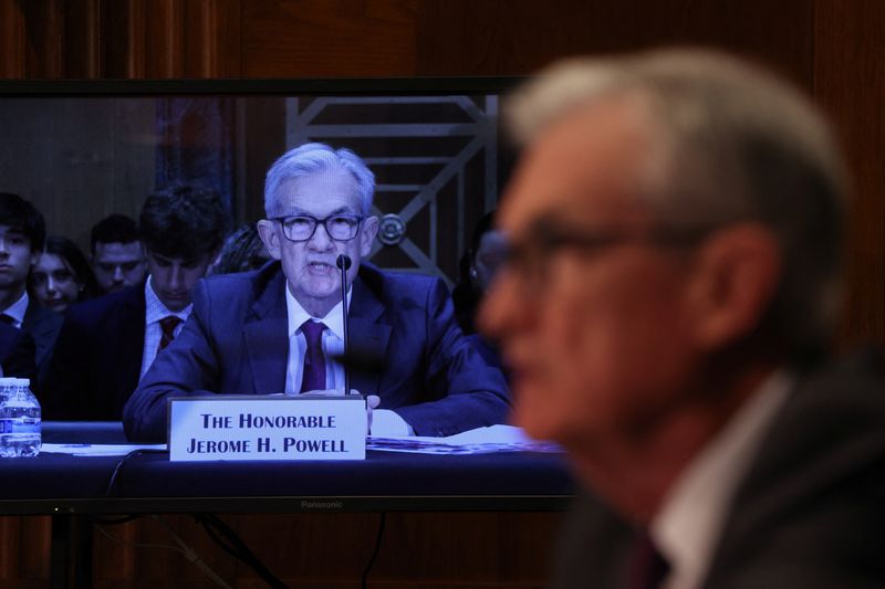 U.S. Federal Reserve Chair Jerome Powell appears on a video monitor as he testifies before a Senate Banking, Housing and Urban Affairs Committee hearing on "The Semiannual Monetary Policy Report to the Congress," on Capitol Hill in Washington, D.C., U.S., June 25, 2025. REUTERS/Kevin Mohatt