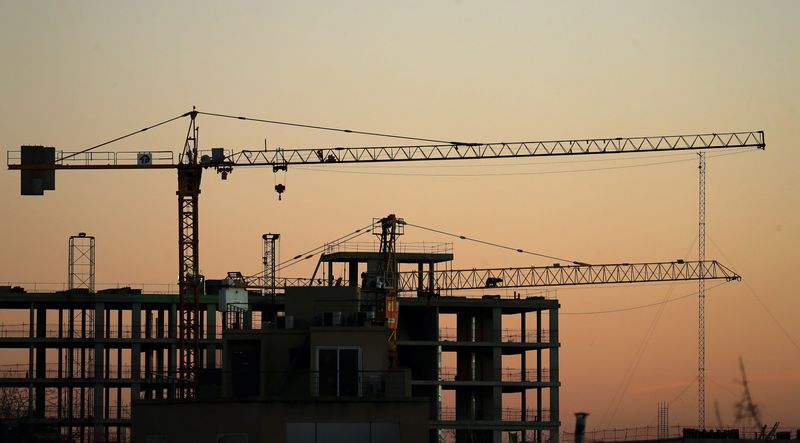 FILE PHOTO: Cranes are seen at sunset at a construction site in Buenos Aires, Argentina September 4, 2018. Picture taken September 4, 2018. REUTERS/Marcos Brindicci/ File Photo
