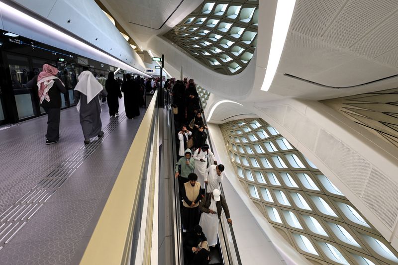 Passengers use the Green Line of Riyadh Metro during a rush hour at the King Abdullah Financial District Metro Station in Riyadh, Saudi Arabia, January 28, 2025. REUTERS/Hamad I Mohammed/File Photo