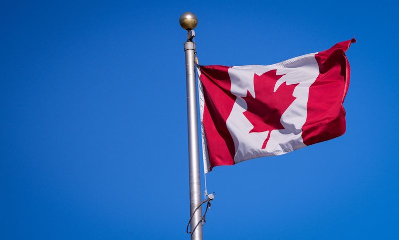 FILE PHOTO: A Canadian flag is pictured a the Manoir Richelieu before the G7 Foreign Ministers summit in La Malbaie, Quebec, Canada March 12, 2025.  REUTERS/Mathieu Belanger/ File Photo