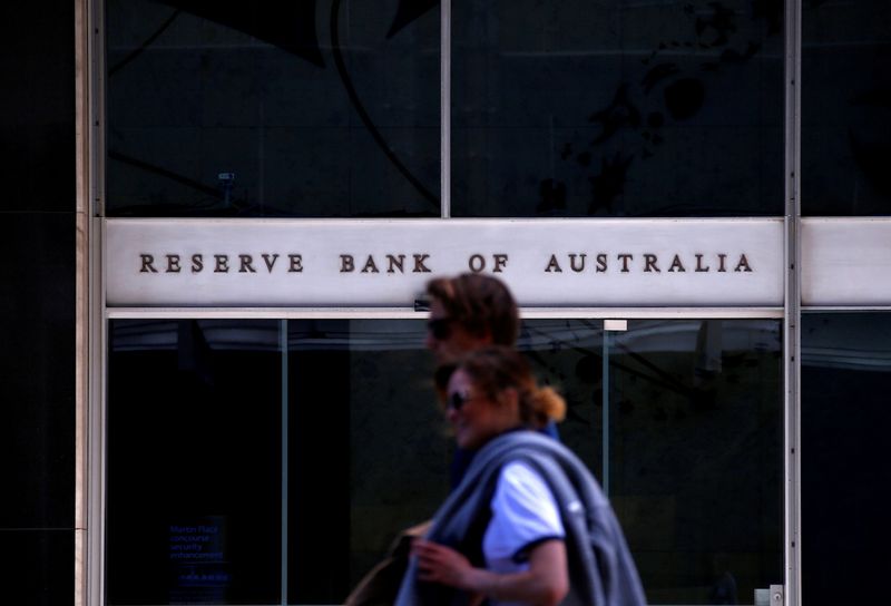 FILE PHOTO: Pedestrians walk past the main entrance to the Reserve Bank of Australia building in central Sydney, Australia, October 3, 2016.  REUTERS/David Gray/ File Photo