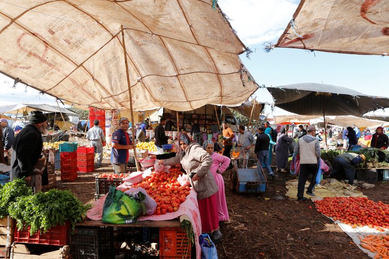 FILE PHOTO: People shop at a vegetable market on the outskirts of Casablanca, Morocco, October 23, 2019. REUTERS/Youssef Boudlal/File Photo
