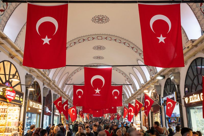 FILE PHOTO: People stroll through the historic Grand Bazaar, a popular tourist attraction and one of the country's most important economic venues, in Istanbul, Turkey, October 22, 2024. REUTERS/Murad Sezer/File Photo