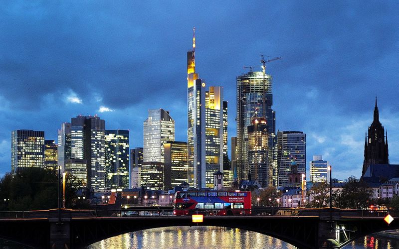 FILE PHOTO: A double decker bus passes the skyline with its dominating banking district in Frankfurt, Germany, November 8, 2023. REUTERS/Kai Pfaffenbach/File Photo