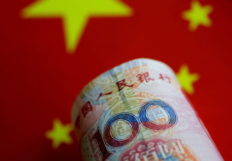 FILE PHOTO: A China yuan note is seen in this illustration photo May 31, 2017.     REUTERS/Thomas White/Illustration/File Photo