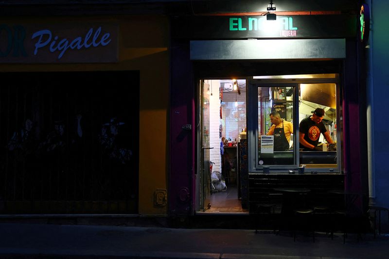 FILE PHOTO: Employees work in a Taqueria restaurant near Pigalle in Paris, France, May 6, 2025. REUTERS/Sarah Meyssonnier/File Photo