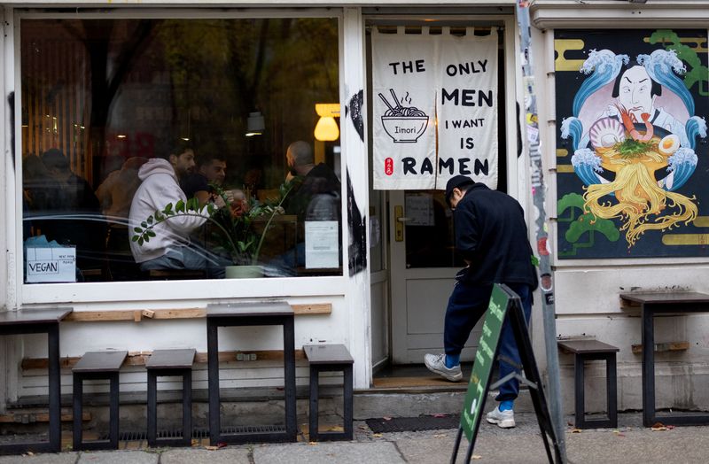 FILE PHOTO: A person enters an Asian restaurant at Scheunenviertel quarter in Berlin, Germany, November 15, 2024. REUTERS/Lisi Niesner/File Photo