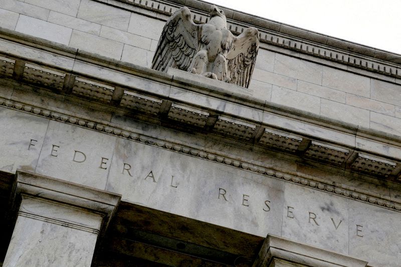 FILE PHOTO: An eagle tops the U.S. Federal Reserve building's facade in Washington, July 31, 2013. REUTERS/Jonathan Ernst/File Photo