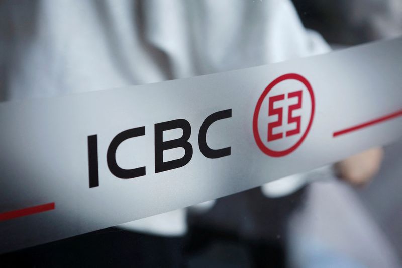 FILE PHOTO: The logo of Industrial and Commercial Bank of China (ICBC) is pictured at the entrance to its branch in Beijing, China April 1, 2019. Picture taken April 1, 2019. REUTERS/Florence Lo/File Photo