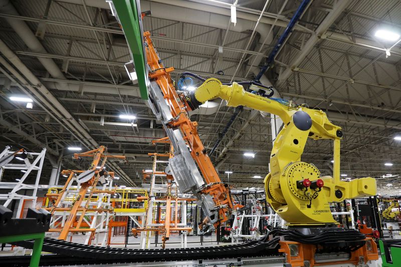 An assembly robot operates on the line at automaker General Motors (GM) Brightdrop unit's CAMI EV Assembly, in Ingersoll, Ontario, Canada December 5, 2022.  REUTERS/Carlos Osorio
