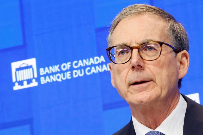 FILE PHOTO: Bank of Canada Governor Tiff Macklem takes part in a press conference, after cutting key interest rate, in Ottawa, Ontario, Canada September 17, 2025. REUTERS/Blair Gable/File Photo