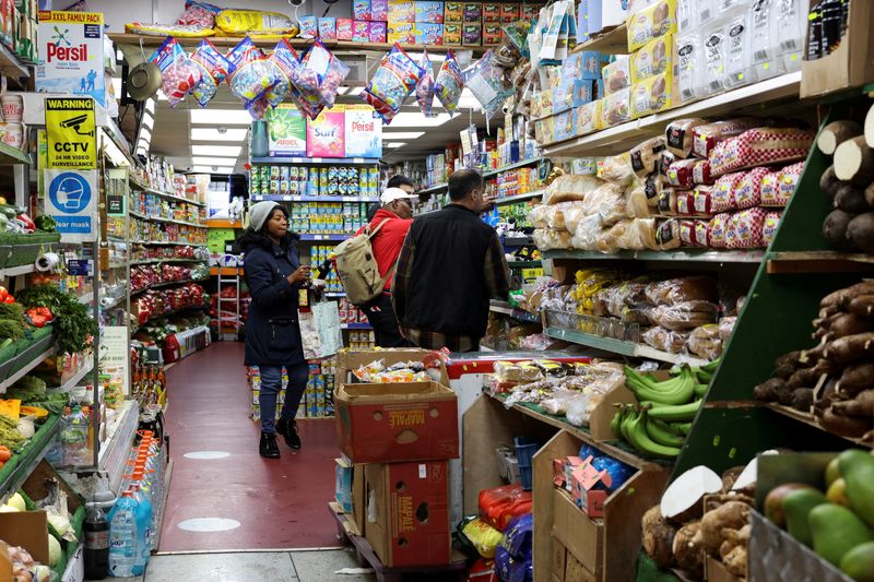 FILE PHOTO: People shop at a grocery market, in London, Britain May 6, 2023. REUTERS/Emilie Madi/File Photo