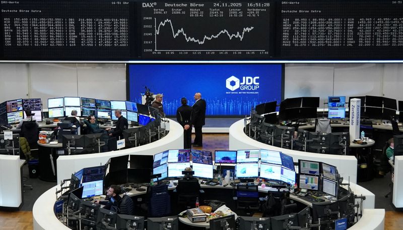 A graph of the German share price index DAX is displayed at the stock exchange in Frankfurt, Germany, November 24, 2025. REUTERS/Staff