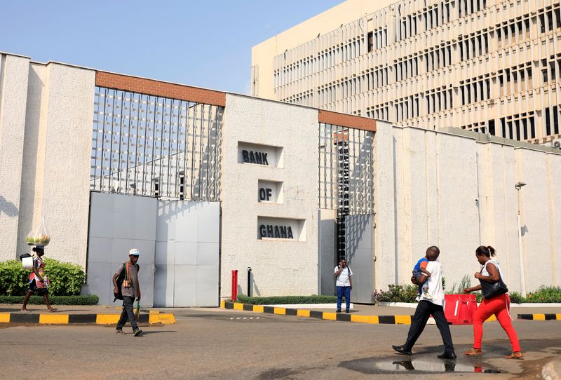 People walk past the Bank of Ghana in Accra, Ghana, November 28, 2018. REUTERS/Zohra Bensemra