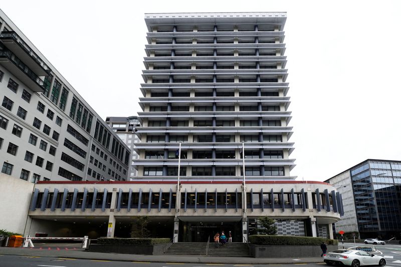 People exit the Reserve Bank of New Zealand building in Wellington, New Zealand, September 24, 2025. REUTERS/Marty Melville