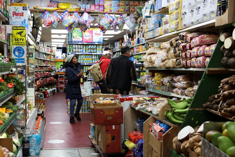 People shop at a grocery market, in London, Britain May 6, 2023. REUTERS/Emilie Madi
