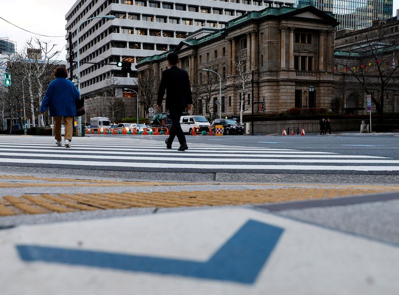 People walk in front of the Bank of Japan building in Tokyo, Japan January 23, 2024. REUTERS/Kim Kyung-Hoon