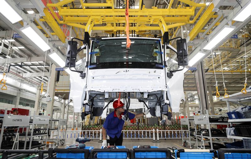 FILE PHOTO: An employee works on a new energy vehicle production line at a BYD factory in Huaian, Jiangsu province, China August 26, 2024. China Daily via REUTERS/File Photo