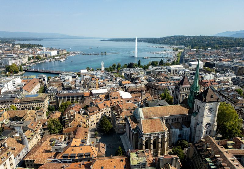 FILE PHOTO: A drone view shows the St. Pierre Cathedral and Lake Leman in Geneva, Switzerland, August 26, 2025. REUTERS/Denis Balibouse/File Photo